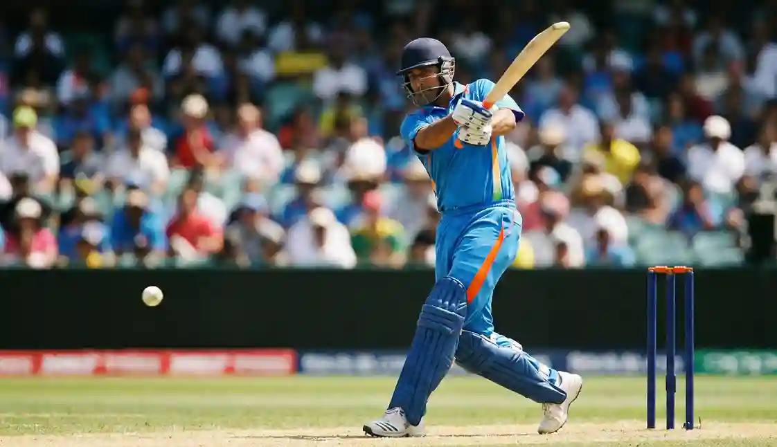 Cricket batsman playing aggressive shot during one-day international match